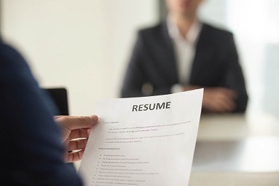 Person Holding a Resume